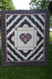 "Log Cabin with Heart Quilt (89 x 102 inches)" for auction at the 2012 Black Creek Pioneer Village Relief Sale