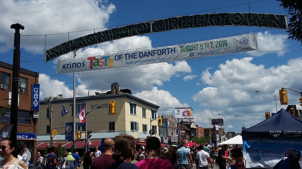 Crowds under the 2016 Taste of the Danforth banner in Toronto.